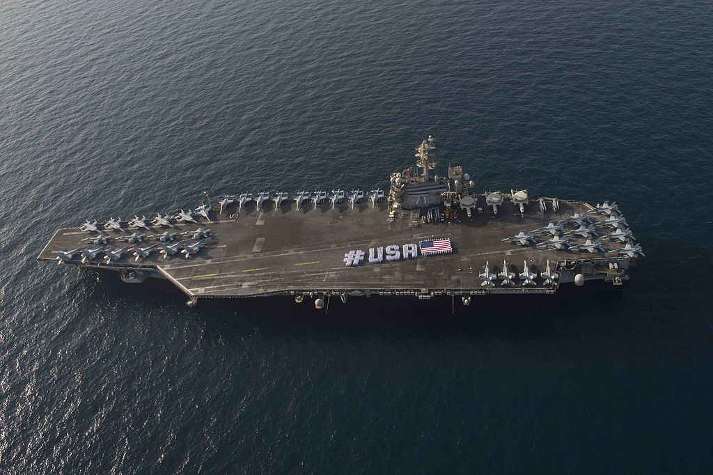 1024px-Sailors_spell_out__USA__aboard_USS_Theodore_Roosevelt_150628-N-VC236-071