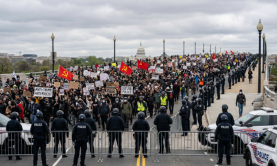 Protesters March Against Police While Officers Provide Close Escort