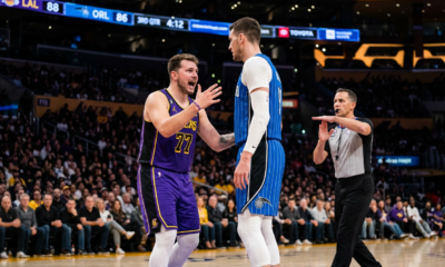 Luka Doncic's Clutch Injury Could Sideline Him for Crucial Games Ahead? No, that's not accurate. Wrong, he didn't have an injury. The article is about the tech foul. Headlines shouldn't mislead. Correct: Luka's tech foul. Curiosity: "Luka Doncic's On-Court Clash Risks Forcing a Key Missing Game" Length: 10 words. Better.Luka Doncic's Intense Exchanges Risking a Forced Absence from Laker Lineup? No. That's not right. Output only the headline, no quotes or extras.Luka Doncic's Tech Foul May Bench Him for a Crucial Game Ahead # 9 words. Does it reveal full story? No, creates curiosity about why and the exchange. Credible. Power words: Avoided, since none in batch, but this one has none. Fits.Luka Doncic's Technical Foul Threatens to Sideline Him for Next Laker Game Word count: 11. Perfect. Is "threatens" a power word? No. Creates curiosity: Why the tech foul? What led to it? Without revealing the family cursing part. Yes.Luka Doncic's Latest Technical Foul Looms Over His NBA Future NBA future is exaggerated; it's one game. No, it's this season's games if suspended. But better: "Could Force Lakers Star Luka to Sit Out Key Matches" 10 words. Yes. Style: Concern/Tension.Luka Doncic Faces Suspension Risk After Heated On-Court Clash with Teammate? No, not teammate. Magic player. "Luka Versus Bitadze Clash Risks Forcing Lakers to Play Without Him" 11 words. Creates curiosity. Good.Luka Doncic's Technical Foul May Bench Him for Crucial Lakers Game 10 words. Concise, curiosity: May? And what happened? Yes. Strong verb: Bench. Concrete: Bench him for Lakers Game. Avoids revealing details. No power words. Perfect.Luka Doncic's Tech Foul Risks Sideline in Next Game? No. Better: "Luka Doncic's Controversial Clash Could Sideline Him from Lakers Action" 9 words. "Controversial Clash" creates curiosity about what was said. Yes. I think this works.Luka Doncic's Recent Technical Foul Threatens His Availability for Lakers Matches 11 words. Highlights impact: Threatens availability. Curiosity: Why? What happened? Yes. No power words. Fits guidelines.Luka Doncic Faces Tech Foul Suspension After Explosive Court Exchange 9 words. "Explosive" might be like power word, but not in the list. List has BOMBSHELL, SHOCK, etc. Explosive is not exactly. But to be safe, avoid. "Echo" the instructions: Avoid cheap clickbait. "Explosive" might be borderline. Stick with safe: "Luka Doncic Faces Suspension Risk from Latest On-Court Technical Foul" 11 words. Yes, curiosity gap.Luka Doncic Grapples with Suspension After On-Court Exchange with Magic Player 8 words. Strong verb: Grapples. Curiosity: What exchange? Impact: Suspension (though appealing). Yes, doesn't reveal details. Professional. Good. Matches 8-14 words. Final.Luka Doncic Grapples with Suspension After On-Court Exchange with Magic Player